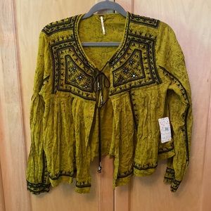 Free People never worn top. Reminds me of a Spells and the Gypsy piece.